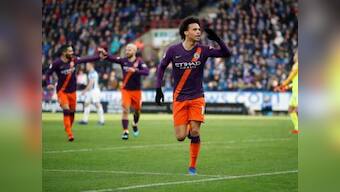 Premier League: Manchester City keep pace with leaders Liverpool with comfortable win at Huddersfield