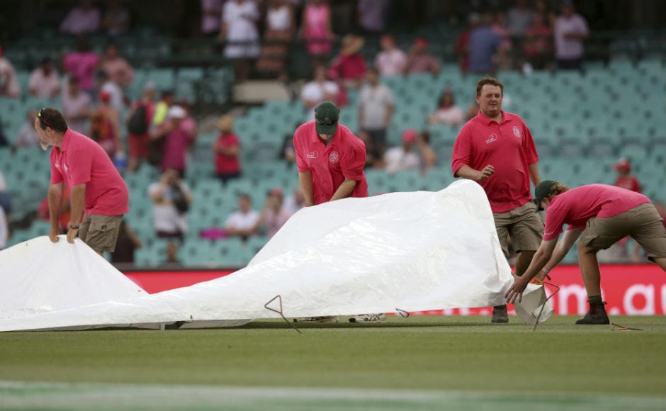 Groundkeepers cover the pitch as rain begins to fall on the Sydney Cricket Ground. 16.3 overs were lost to bad light, which means Day 4 will begin 30 minutes early on Sunday with Australia still 386 runs behind. Groundkeepers cover the pitch as rain begins to fall on the Sydney Cricket Ground. 16.3 overs were lost to bad light, which means Day 4 will begin 30 minutes early on Sunday with Australia still 386 runs behind.