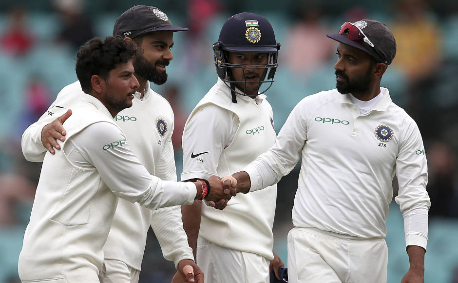 Kuldeep Yadav (left) was India's star bowler on the fourth day, which was hampered by rain. Amidst the drizzle, Kuldeep picked his maiden fifer in Australia in only in first Test Down Under. AP Kuldeep Yadav (left) was India's star bowler on the fourth day, which was hampered by rain. Amidst the drizzle, Kuldeep picked his maiden fifer in Australia in only in first Test Down Under. AP