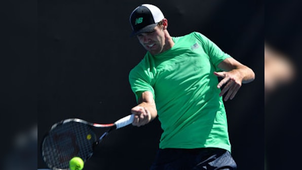 Australian Open 2019: Ninth seed John Isner knocked out in first round by Reilly Opelka in battle of giants