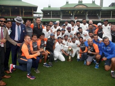 The Indian cricket team and support staff celebrate their series win over Australia after play was called off on day 5 of their cricket test match in Sydney, Monday, Jan. 7, 2019. The match is a draw and India wins the series 2-1. (AP Photo/Rick Rycroft)