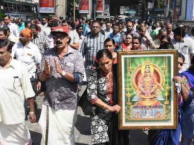 Protestors hold a picture of Lord Ayyappa during a protest called by various Hindu organisations in Kochi on Wednesday. PTI
