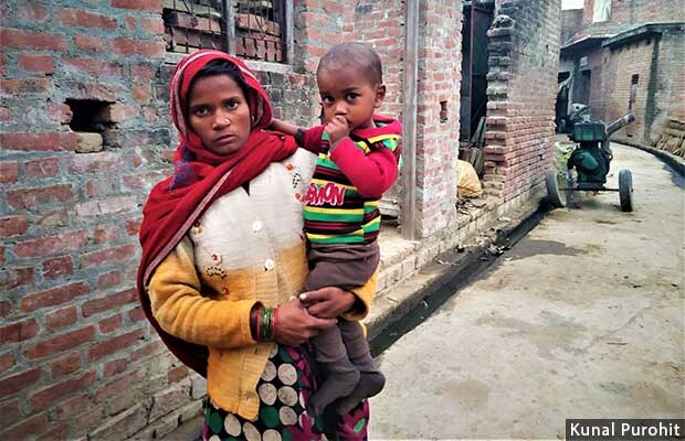 Satwati, whose husband Mukesh has been arrested on charges of lynching Shahrukh Khan, with her son, Naval.
