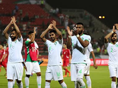 Saudi Arabia’s players celebrate after winning during the 2019 AFC Asian Cup group E football match between Saudi Arabia and North Korea at the Maktoum Bin Rashid Al-Maktoum Stadium in Dubai on January 8, 2019. (Photo by Karim Sahib / AFP)