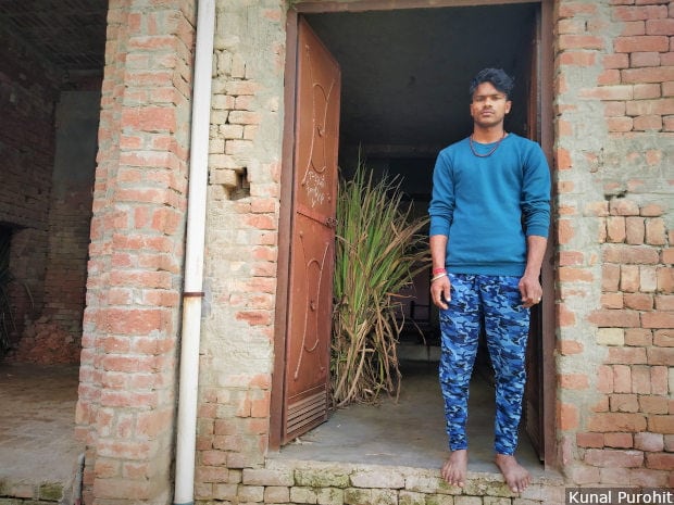 Sumit Kumar at the door of his house in Purbaliyan village in western Uttar Pradesh’s Muzaffarnagar district. He is the complainant in two FIRs filed after a fight over a cricket match escalated. Image/Kunal Purohit