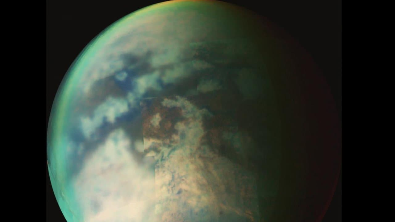 New research provides evidence of rainfall on the north pole of Titan – the largest of Saturn’s moons. The rainfall would be significant to researchers, who have been waiting to spot the first signs of summer in the moon’s northern hemisphere. Image: NASA/JPL