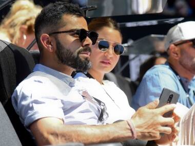 Virat Kholi and Anushka Sharma watch the third round match between Novak Djokovic and Denis Shapovalov at the Australian Open. AP