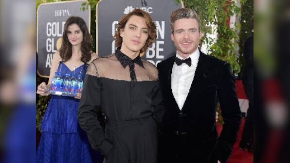 Golden Globes 2019: Fiji Water girl goes viral after photobombing celebrities on red carpet