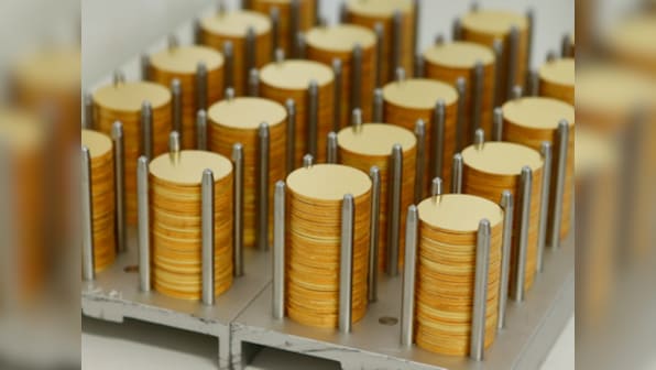Gold rises to three-month high, set for best year since 2010 on weakening dollar, year-end buys
