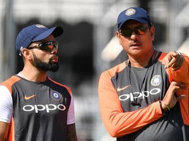 India’s captain Virat Kohli (L) talks with India’s head coach Ravi Shastri (R) during a practice session at Lord’s Cricket Ground in London on August 7, 2018 ahead of the second Test cricket match between England and India. (Photo by Ben STANSALL / AFP) / RESTRICTED TO EDITORIAL USE. NO ASSOCIATION WITH DIRECT COMPETITOR OF SPONSOR, PARTNER, OR SUPPLIER OF THE ECB