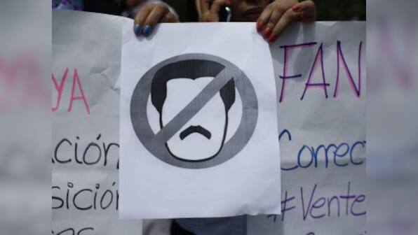 Venezuelans take to streets in walkout to push Nicolas Maduro out: Juan Guaido transforms into commanding force with Trump's backing