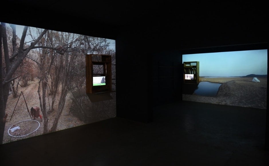 In the display <em>Of a Flux of Hopes</em>, the wall projection overlaps with another video playing in the cabinet such that the India video juxtaposed with Iran's, Iran's is juxtaposed with Jerusalem and so on to showcase the idea of a ‘a story within a story’. Image via Astha Butail studio and The Gujral Foundation In the display <em>Of a Flux of Hopes</em>, the wall projection overlaps with another video playing in the cabinet such that the India video juxtaposed with Iran's, Iran's is juxtaposed with Jerusalem and so on to showcase the idea of a ‘a story within a story’. Image via Astha Butail studio and The Gujral Foundation
