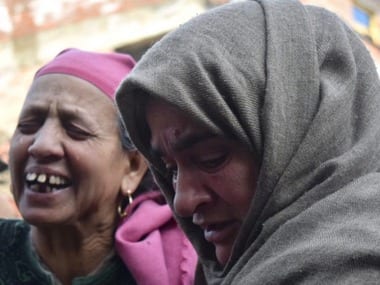 Ishrat Muneer's relatives outside her home on Friday. Image courtesy: Sameer Yasir