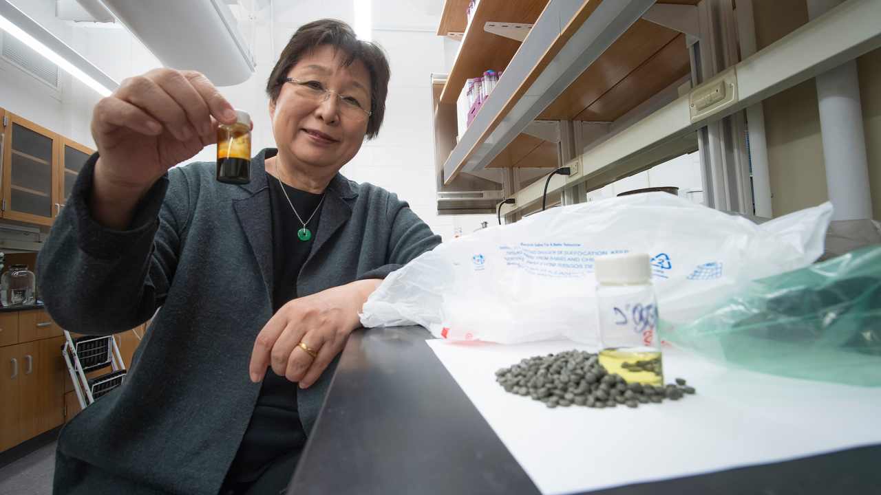 Dr Wang showing a vial of the fuel made from plastic in her lab. Image courtesy: Purdue