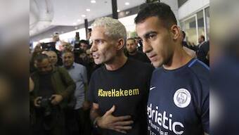 Refugee footballer Hakeem al-Araibi makes triumphant return to Australia after Bahrain drops extradition proceedings