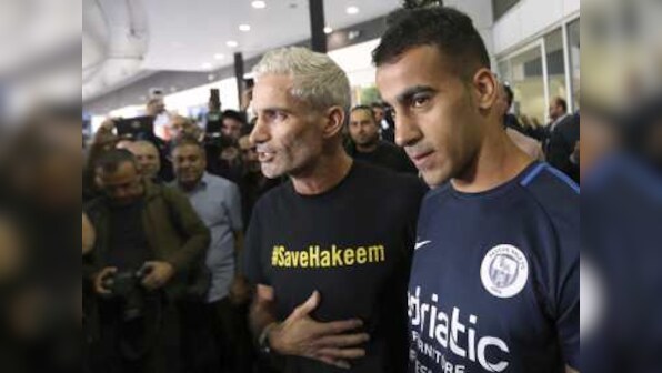 Refugee footballer Hakeem al-Araibi makes triumphant return to Australia after Bahrain drops extradition proceedings