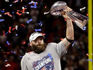 New England Patriots’ Julian Edelman (11) holds the Vince Lombardi Trophy after the NFL Super Bowl 53 football game against the Los Angeles Rams, Sunday, Feb. 3, 2019, in Atlanta. The Patriots won 13-3. Edelman was named the Most Valuable Player. (AP Photo/Mark Humphrey)