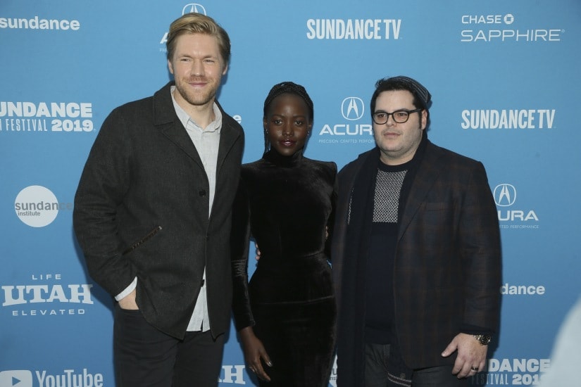 Alexander England, from left, Lupita Nyong'o and Josh Gad pose at the premiere of the film "Little Monsters" during the 2019 Sundance Film Festival, Tuesday, Jan. 29, 2019, in Park City, Utah. (Photo by Danny Moloshok/Invision/AP)