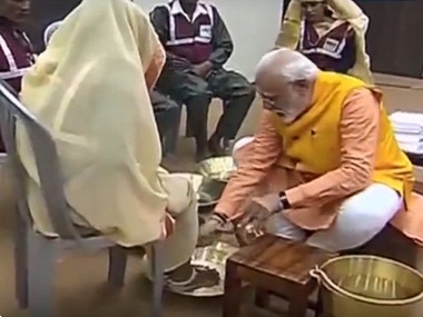 By washing feet of sanitation workers, Narendra Modi delivers message of inclusivity as well as blow to Opposition's politics By washing feet of sanitation workers, Narendra Modi delivers message of inclusivity as well as blow to Opposition's politics