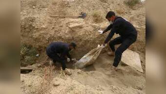 Largest Islamic State mass grave with 3,500 bodies found outside Syria's Raqqa; HRW says work against group 'not over'