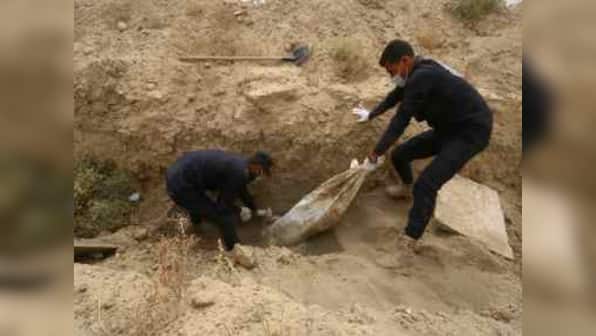 Largest Islamic State mass grave with 3,500 bodies found outside Syria's Raqqa; HRW says work against group 'not over'