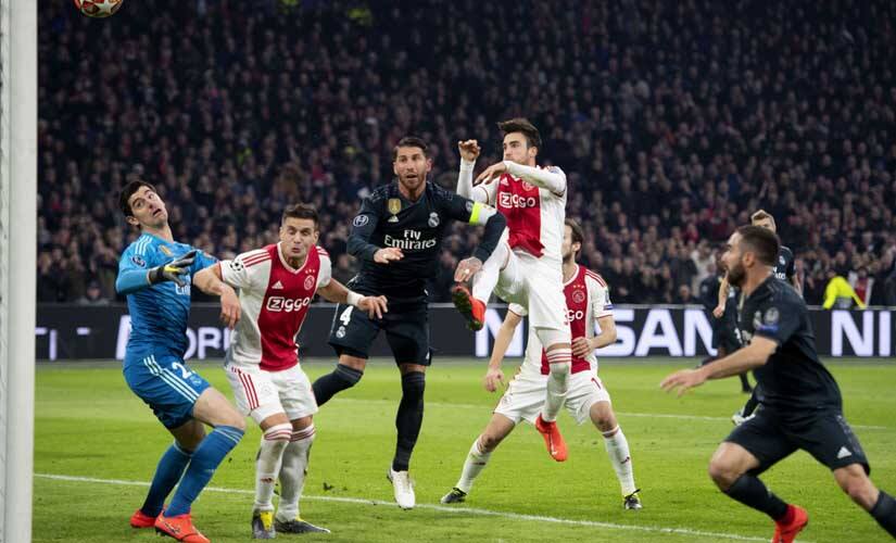Ajax's Argentine defender Nicolas Tagliafico (C) scores a goal which would go on to be rejected after VAR deliberation as Ajax's Serbian forward Dusan Tadic was found to be in an offside position. AFP