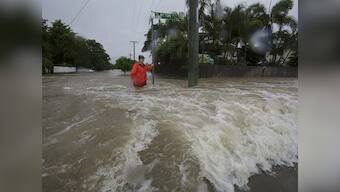 Australia's military steps in to tackle ‘once in a century’ floods as downpour causes damage to property, brings crocs into streets