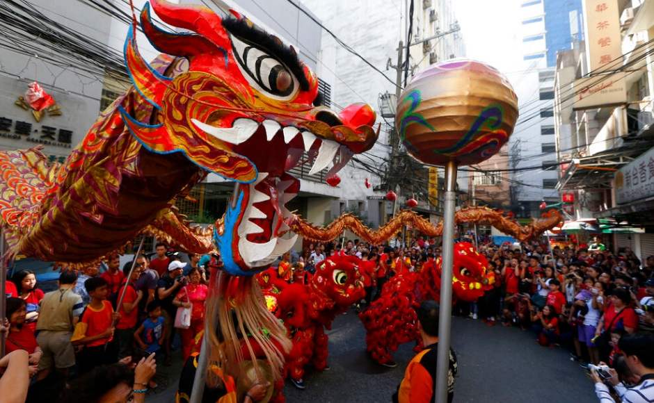 Prayers and performances mark Lunar New Year as Chinese communities in