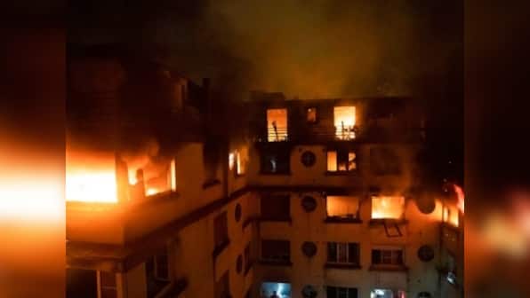 Eight dead in Paris after fire breaks out at apartment block; police suspect arson attack, arrest one