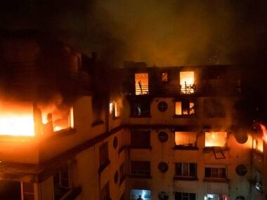 Eight dead in Paris after fire breaks out at apartment block; police suspect arson attack, arrest one