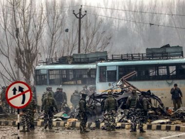 Security personnel carry out rescue and relief works at the site of suicide bomb attack at Lathepora Awantipora in Pulwama district of south Kashmir on Thursday. PTI
