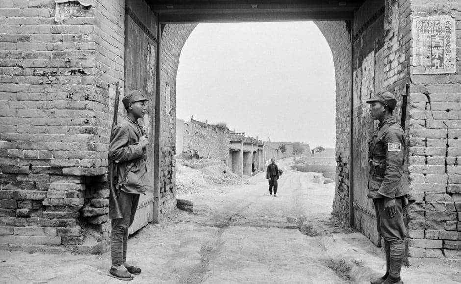 This photograph depicts the Yan'an City Gate which served as the entrance to China's Red Capital. The exhibition curated by Gayatri Sinha and Peter Pfrunder offers a comparison between two dominant figures of Asia through the common lens of the photojournalist. Image courtesy Fotostiftung Schweiz / Archiv für Zeitgeschichte This photograph depicts the Yan'an City Gate which served as the entrance to China's Red Capital. The exhibition curated by Gayatri Sinha and Peter Pfrunder offers a comparison between two dominant figures of Asia through the common lens of the photojournalist. Image courtesy Fotostiftung Schweiz / Archiv für Zeitgeschichte