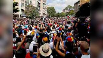 Venezuela crisis: Juan Guaido calls for nationwide march on Caracas; Maduro says he will 'never surrender'