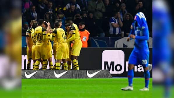 Bundesliga: Marco Reus sends Borussia Dortmund atop standings with late winner against Hertha Berlin; Schalke lose again