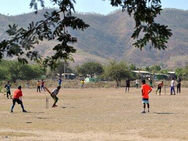 Local playing cricket in Dili, the capital of East Timor. AFP