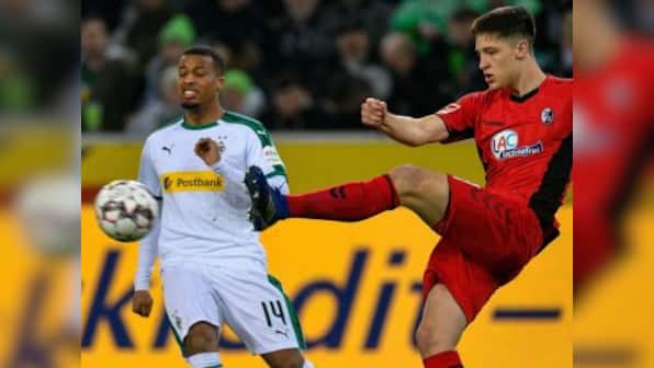 Bundesliga: Borussia Moenchengladbach's bid for Champions League qualification suffers setback after draw against Freiburg