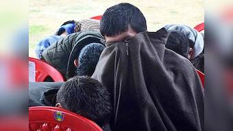 Afraid of social boycott, BJP workers hide their faces at Kashmir rally; despite recent gains, backing saffron party still a taboo in Valley