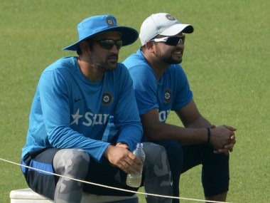 File image of MS Dhoni (L) and Suresh Raina. AFP