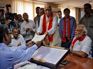 Narendra Modi once again assists LK Advani in filing nominations for the 2014 Lok Sabha election. Reuters