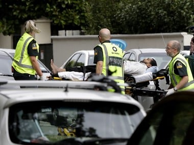 Ambulance staff take a man from outside a mosque in central Christchurch, which was attacked on Friday. AP