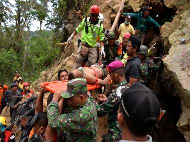 Eight killed in Indonesia gold mine collapse; rescue teams deploy excavator to search for three dozen still feared trapped Eight killed in Indonesia gold mine collapse; rescue teams deploy excavator to search for three dozen still feared trapped