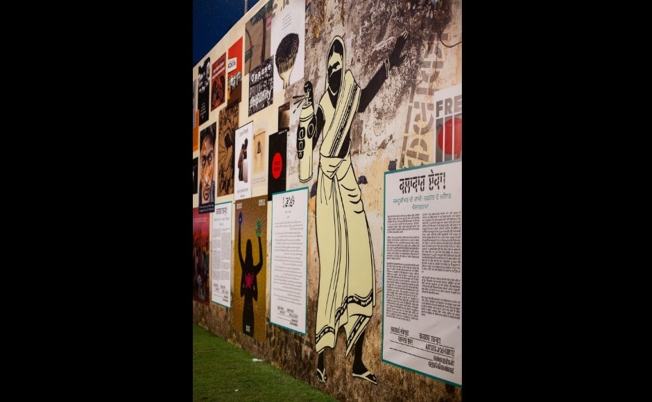 Poster wall featuring the declaration text behind the Artists Unite! Movement, as well as posters by many different artists from across the country. The image in the front of the large woman with the spray can is by Kochi based artist Guess Who. Poster wall featuring the declaration text behind the Artists Unite! Movement, as well as posters by many different artists from across the country. The image in the front of the large woman with the spray can is by Kochi based artist Guess Who.