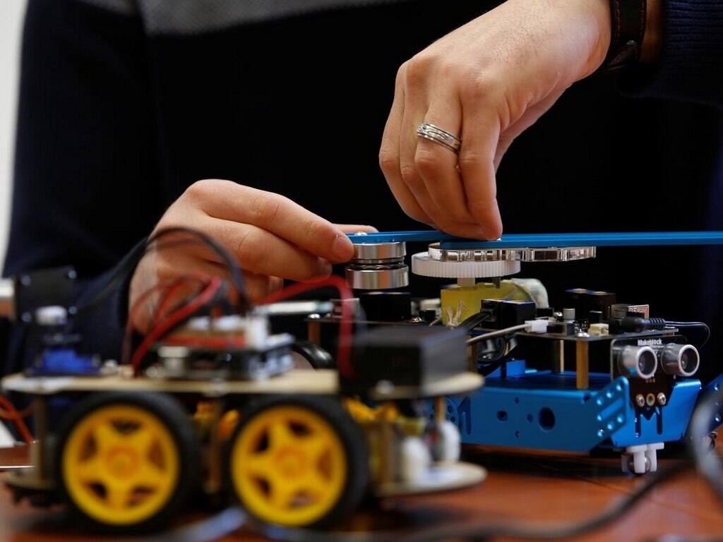 FILE PHOTO: A research support officer and PhD student works on his artificial intelligence projects to train robots to autonomously carry out various tasks, at the Department of Artificial Intelligence in the Faculty of Information Communication Technology at the University of Malta in Msida, Malta February 8, 2019. REUTERS/Darrin Zammit Lupi