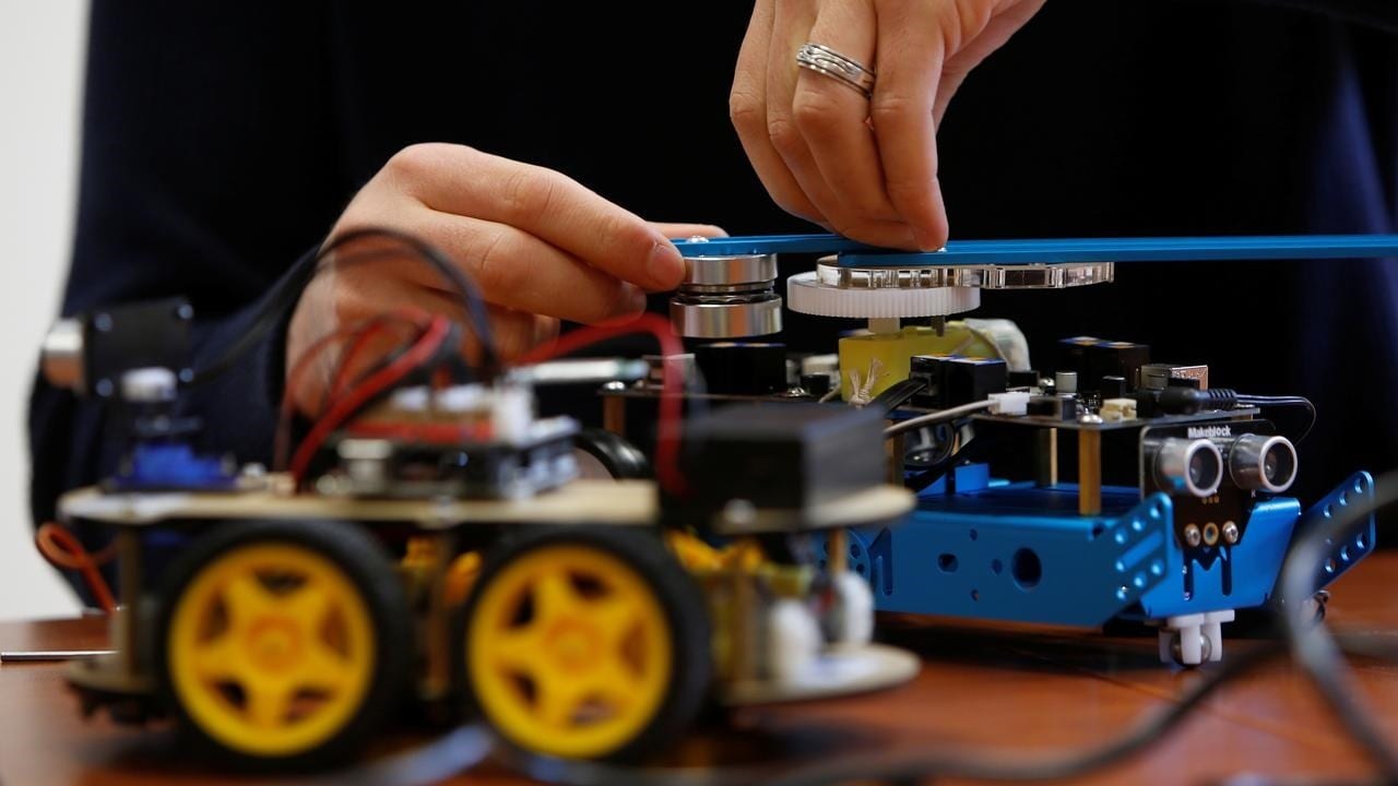 Researcher students working on their artificial intelligence project to train robots to autonomously carry out tasks at the University of Malta in February 2019. Image: UoM