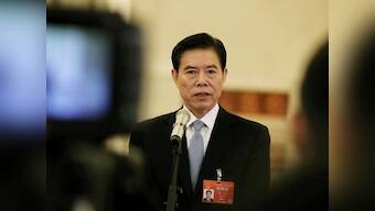 Amid struggle to resolve bitter trade dispute, China says can 'absolutely' negotiate opening its financial sector to US