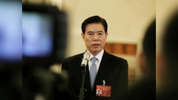 Amid struggle to resolve bitter trade dispute, China says can 'absolutely' negotiate opening its financial sector to US