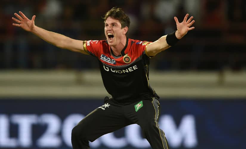 Royal Challengers Bangalore cricketer Adam Milne appeals unsuccessfully against Gujarat Lions batsman Brendon McCullum during the 2017 Indian Premier League(IPL) Twenty20 cricket match between Gujarat Lions and Royal Challengers Bangalore at the Saurashtra Cricket Association Stadium in Rajkot on April 18, 2017. GETTY OUT / —-IMAGE RESTRICTED TO EDITORIAL USE - STRICTLY NO COMMERCIAL USE—– (Photo by INDRANIL MUKHERJEE / AFP) / —-IMAGE RESTRICTED TO EDITORIAL USE - STRICTLY NO COMMERCIAL USE—– / GETTYOUT