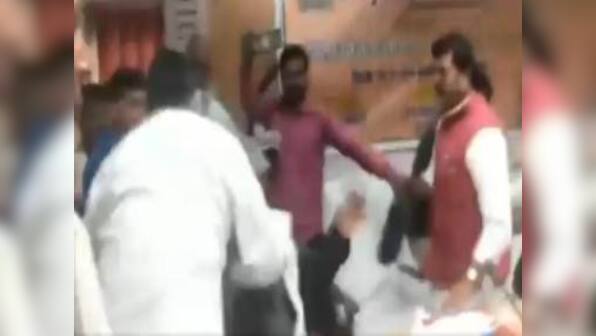 BJP MP Sharad Tripathi attacks party MLA Rakesh Baghel with shoe after quarrel over foundation stone for UP road