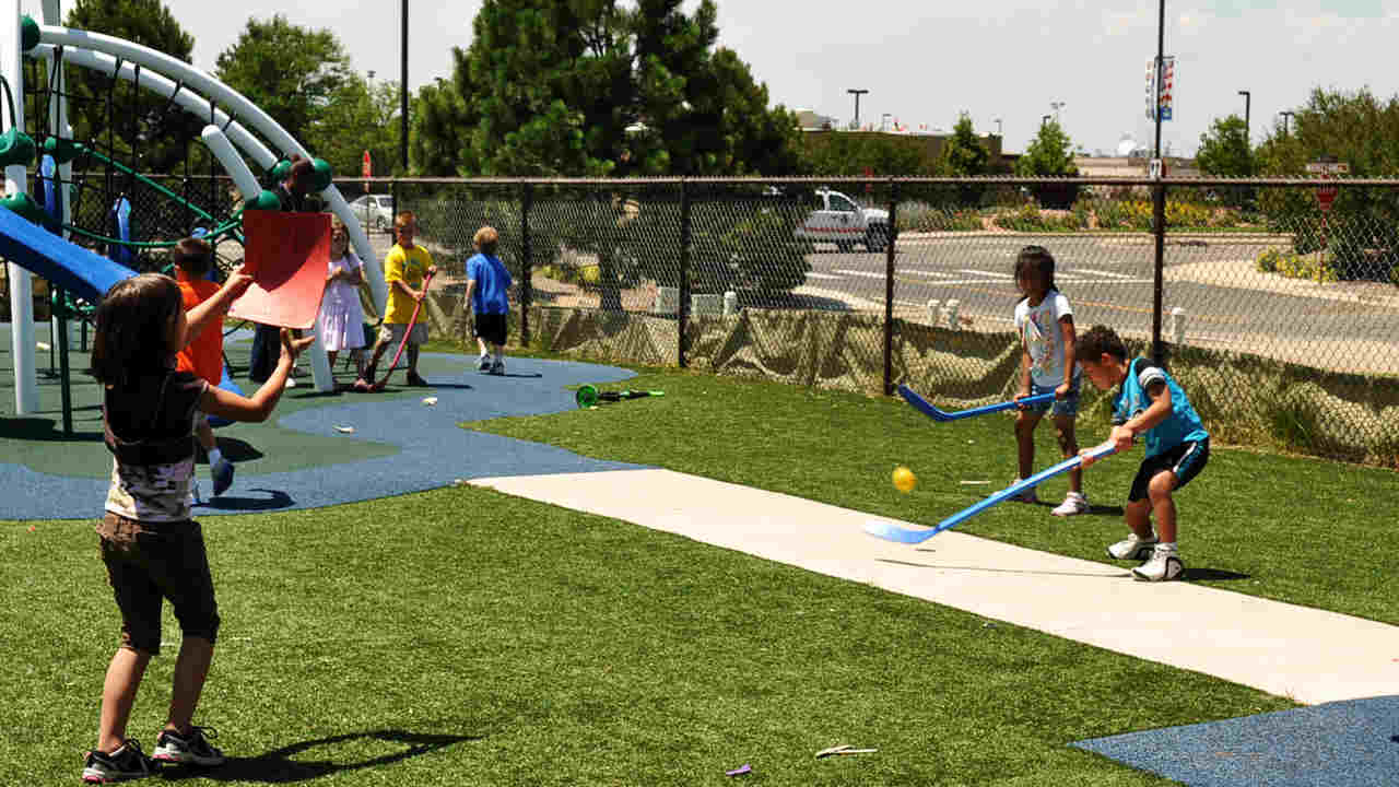 children playing in a park. Image credit: Buckley AFB