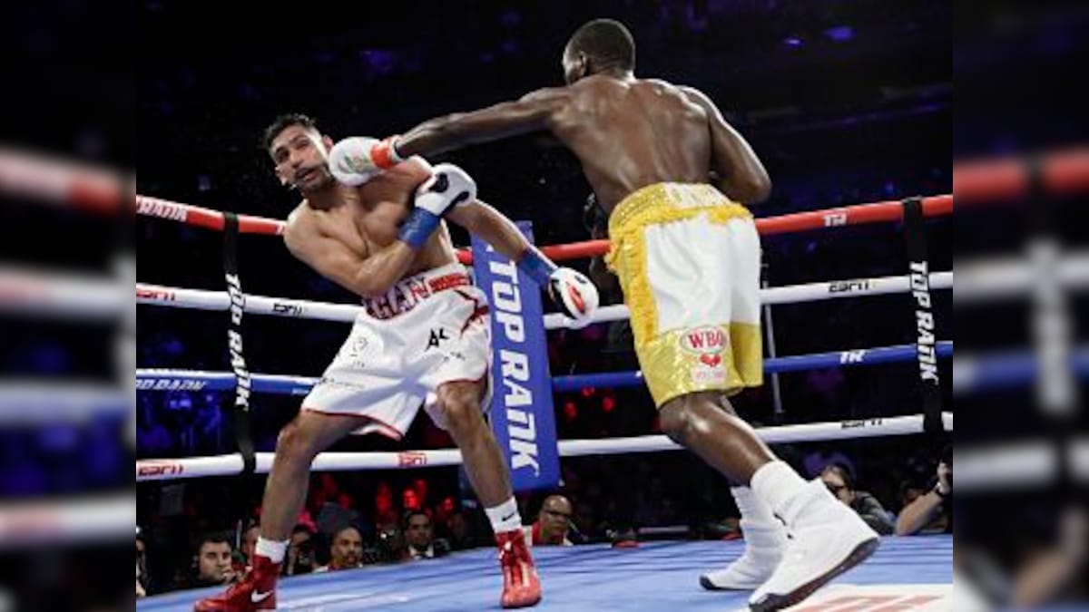 Terence Crawford retains WBO welterweight title after accidental low blow renders Amir Khan unable to continue